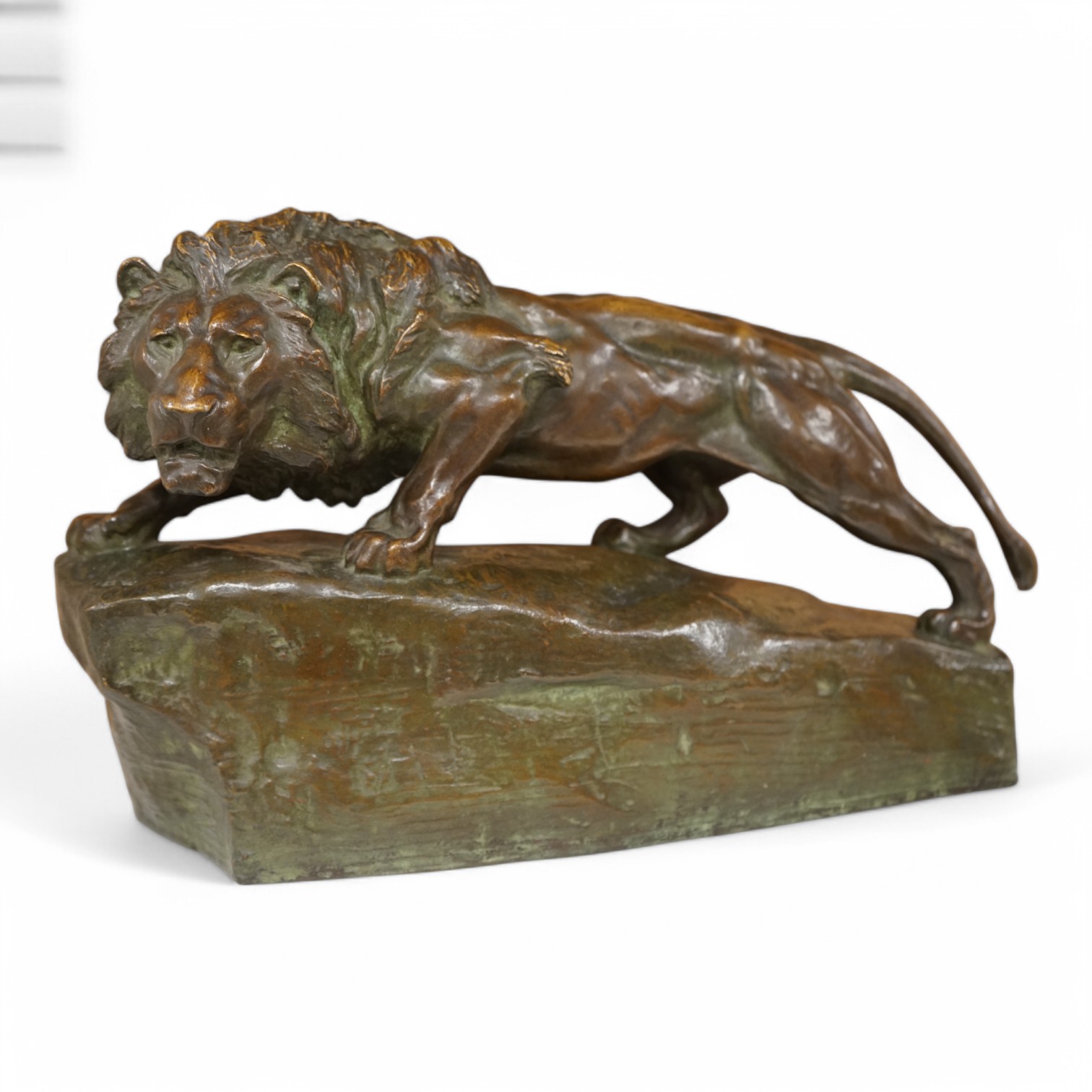 A bronze study of a lion, indistinctly signed and dated 1905, 40cm wide. Condition - good